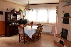 a dining room table and chairs in a room at Holiday home in Balatonkeresztur 19234 in Balatonkeresztúr