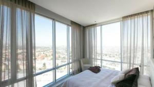 a bedroom with a bed and a large window at Yellow & Blue Apartment HP - Sur in Mexico City +28 photos