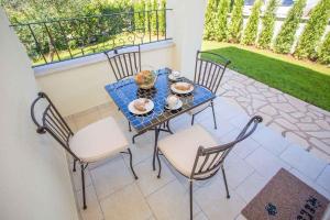 a table and chairs on a patio at Apartment in Nova Vas - Istrien 35437 in Nova Vas