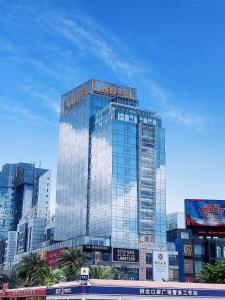 a tall building with a hotel sign on top of it at L Hotels Changsheng Branch in Zhuhai