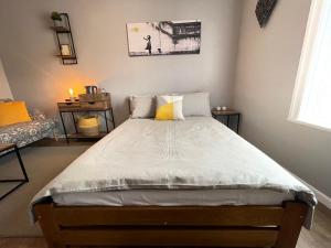 a bedroom with a large bed in a room at Westend Holiday Room 4 Brecon in Brecon