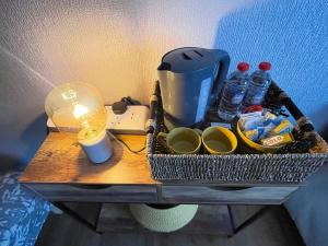 a table with a coffee maker and drinks on it at Westend Holiday Room 4 Brecon in Brecon