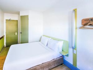 Postel nebo postele na pokoji v ubytování ibis Budget - Dandenong