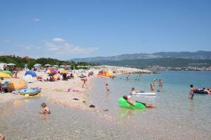 a group of people on the beach at a beach at Apartment in Silo/Insel Krk 13583 in Šilo