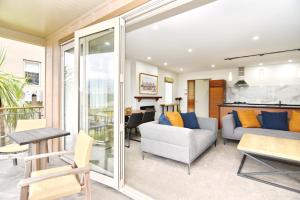 a living room with a couch and a table at High Country Villa 250 - Terrace Downs in Windwhistle