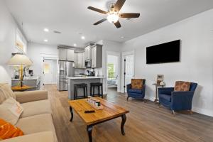 a living room with a couch and a table at Hibiscus Hideaway in Tarpon Springs