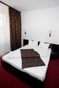 Postel nebo postele na pokoji v ubytování Hotel Terra