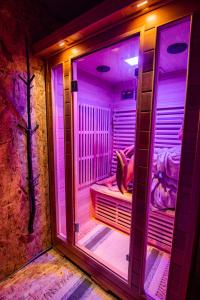 a room with a person sitting on a bed at Panorama Glamping Visole in Slovenska Bistrica