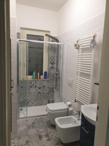 Ett badrum på CASA GINEVRA