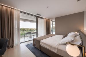 Aparthotel Joel客房内的一张或多张床位