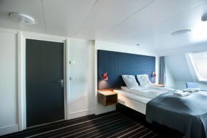 DFDS MiniCruise Oslo - Copenhagen - Oslo tesisinde bir odada yatak veya yataklar