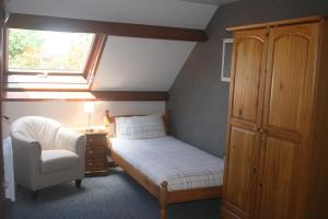 Un pat sau paturi într-o cameră la Au Petit Bled
