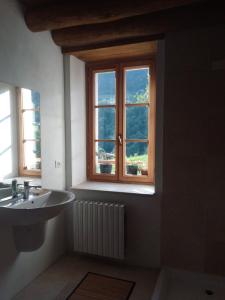 a bathroom with a sink and a window at Ca' del Rì in Gargnano