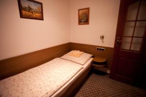 Postel nebo postele na pokoji v ubytování Hotel U Jiřího