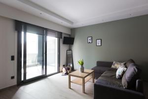 A seating area at 12 Reasons Why Metaxourgeio