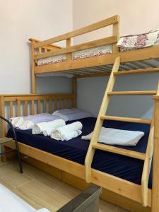 a bunk bed with two bunk beds in a room at Bukhta in Vapnyarka