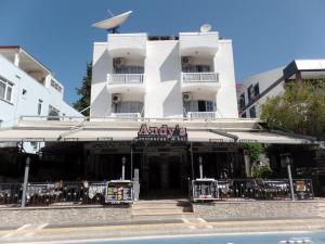 a building with a restaurant in front of it at Andy's Apart Hotel in Marmaris