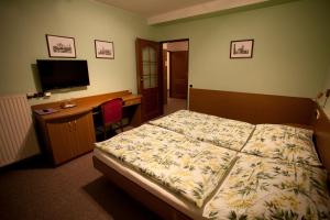 Postel nebo postele na pokoji v ubytování Hotel U Jiřího