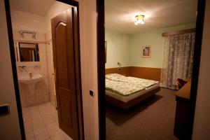 Postel nebo postele na pokoji v ubytování Hotel U Jiřího
