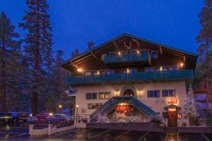 a large building with a balcony on top of it at Austria Hof Lodge in Mammoth Lakes