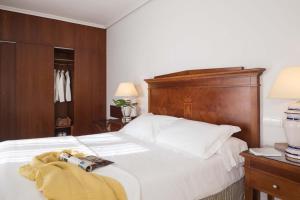 Posteľ alebo postele v izbe v ubytovaní Hotel Rey Alfonso X