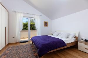 Katil atau katil-katil dalam bilik di Villa Ida
