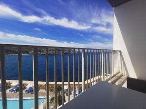 a balcony with a view of the ocean at Paradise Bay Resort in Mellieħa
