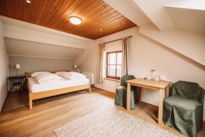 Postel nebo postele na pokoji v ubytování Weinhotel Maitz Wolfgang