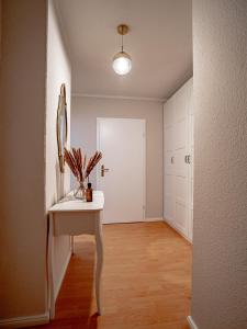 a bathroom with a white sink and a mirror at Altstadtjuwel in Meißen