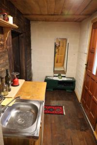 a kitchen with a sink in a room at Збориште in Brdo