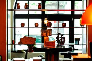 a room with a table in front of a window at BRYK Hotel - Maestro in Odesa