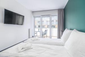 Posteľ alebo postele v izbe v ubytovaní Green Sea Apartamenty Kasprowicza + 10 fotografií