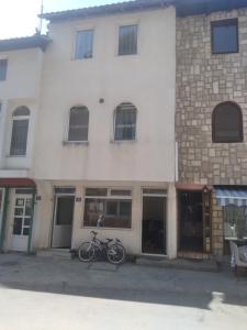 a bike parked in front of a building at Guest house Erdan in Plav