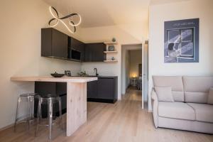 a kitchen and living room with a table and a couch at La Casa 570 in Perugia +46 photos