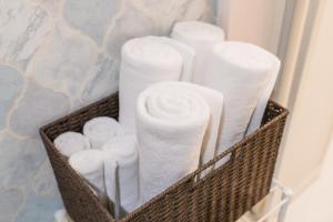 a basket filled with toilet paper in a bathroom at Hotel Santa Barbara Miyakojima Resort in Miyako-jima