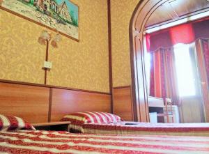 Postel nebo postele na pokoji v ubytování Hotel Artromano