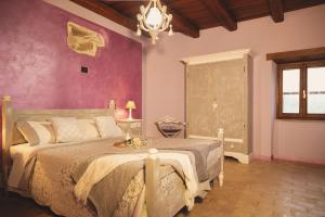 En eller flere senger på et rom på Casa di campagna