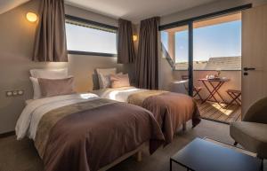 Postel nebo postele na pokoji v ubytování James Vignoble Hôtel, Eguisheim + 37 fotografií