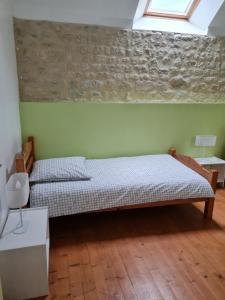 Postel nebo postele na pokoji v ubytování Domaine De La Cour Vautier