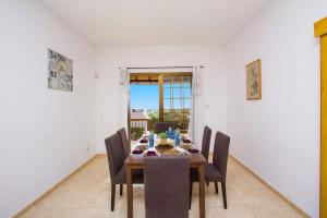 a dining room with a table and chairs at Iliada Villa 4 in Peyia