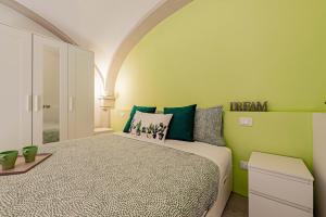 Łóżko lub łóżka w pokoju w obiekcie Realkasa Luxury S.Orsola Apartments