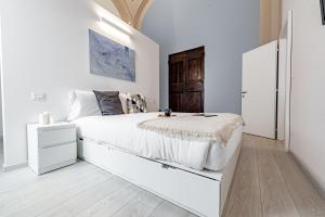 Łóżko lub łóżka w pokoju w obiekcie Realkasa Luxury S.Orsola Apartments