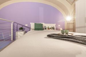 Łóżko lub łóżka w pokoju w obiekcie Realkasa Luxury S.Orsola Apartments