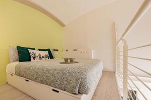 Łóżko lub łóżka w pokoju w obiekcie Realkasa Luxury S.Orsola Apartments