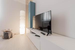 Telewizja i/lub zestaw kina domowego w obiekcie Realkasa Luxury S.Orsola Apartments