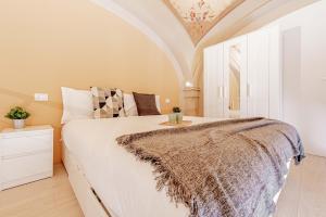 Łóżko lub łóżka w pokoju w obiekcie Realkasa Luxury S.Orsola Apartments
