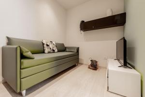 Telewizja i/lub zestaw kina domowego w obiekcie Realkasa Luxury S.Orsola Apartments