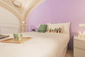 Łóżko lub łóżka w pokoju w obiekcie Realkasa Luxury S.Orsola Apartments