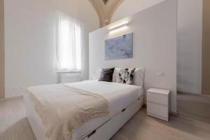 Łóżko lub łóżka w pokoju w obiekcie Realkasa Luxury S.Orsola Apartments