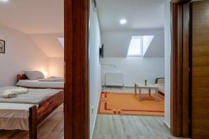 Giường trong phòng chung tại Prenoćište BRAĆA SEKULIĆI